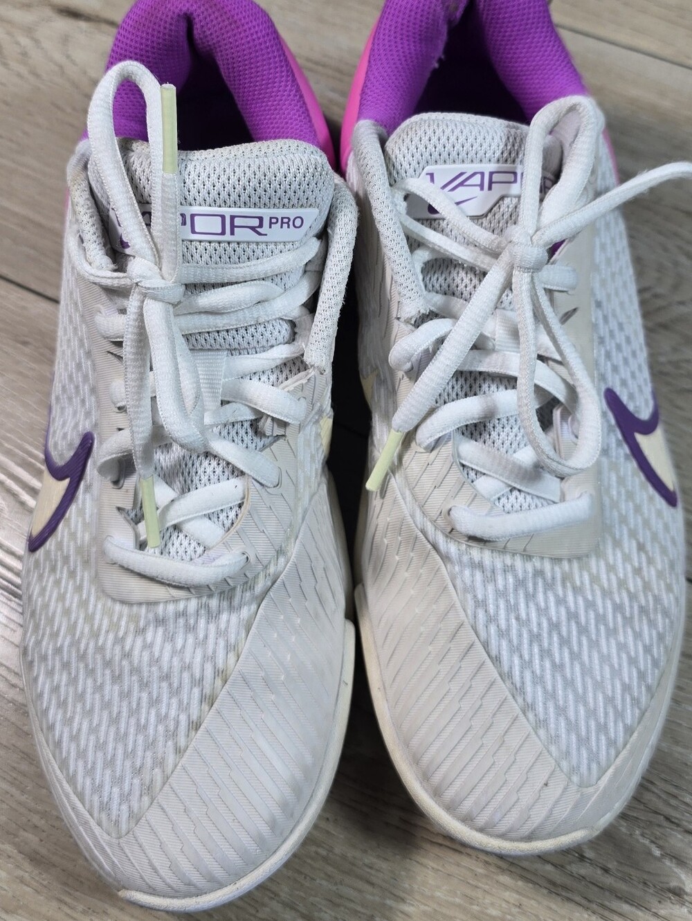 Nike Women’s White Tennis Shoes with Purple Accents